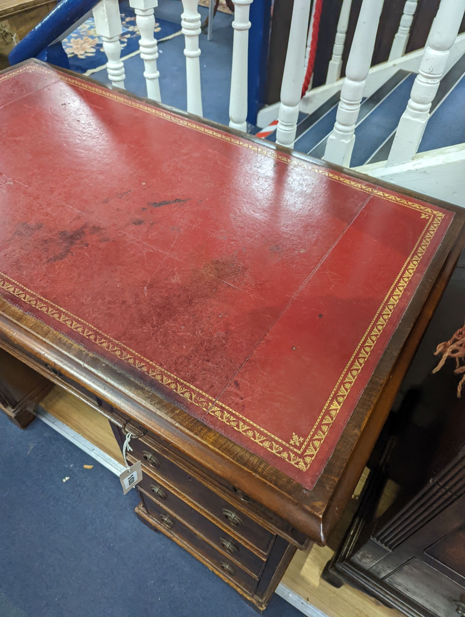 A Victorian mahogany pedestal desk with red leather inset top, length 126cm, depth 71cm, height 77cm